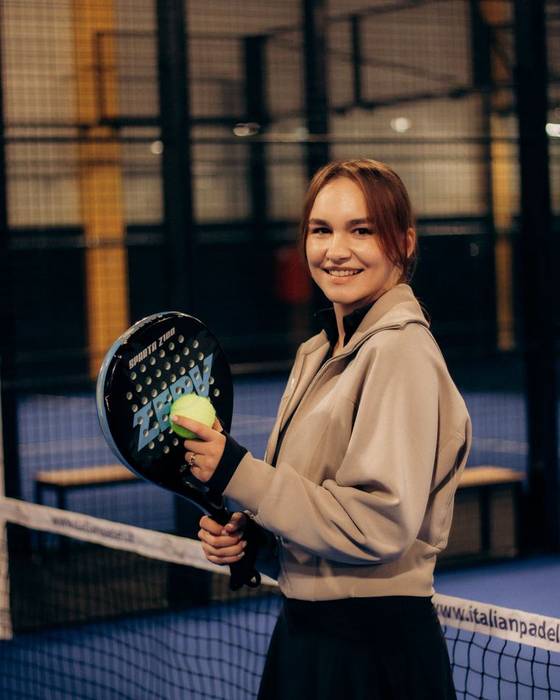 Player smiling on court after a match